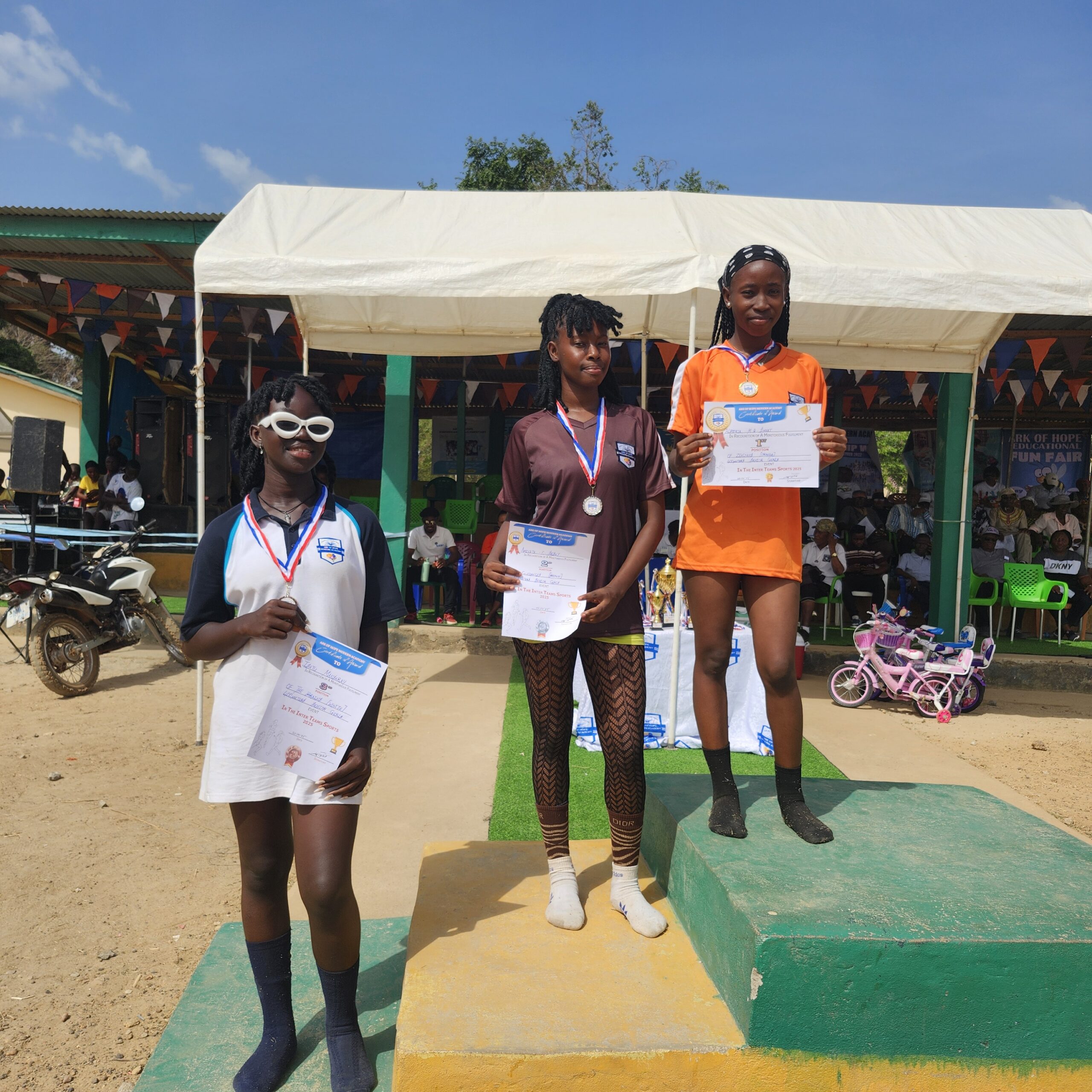 Ark of Hope students receiving certificates and medals